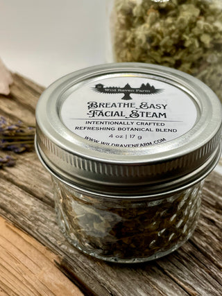 Jar of 'Breathe Easy Facial Steam' with a label on a wooden surface