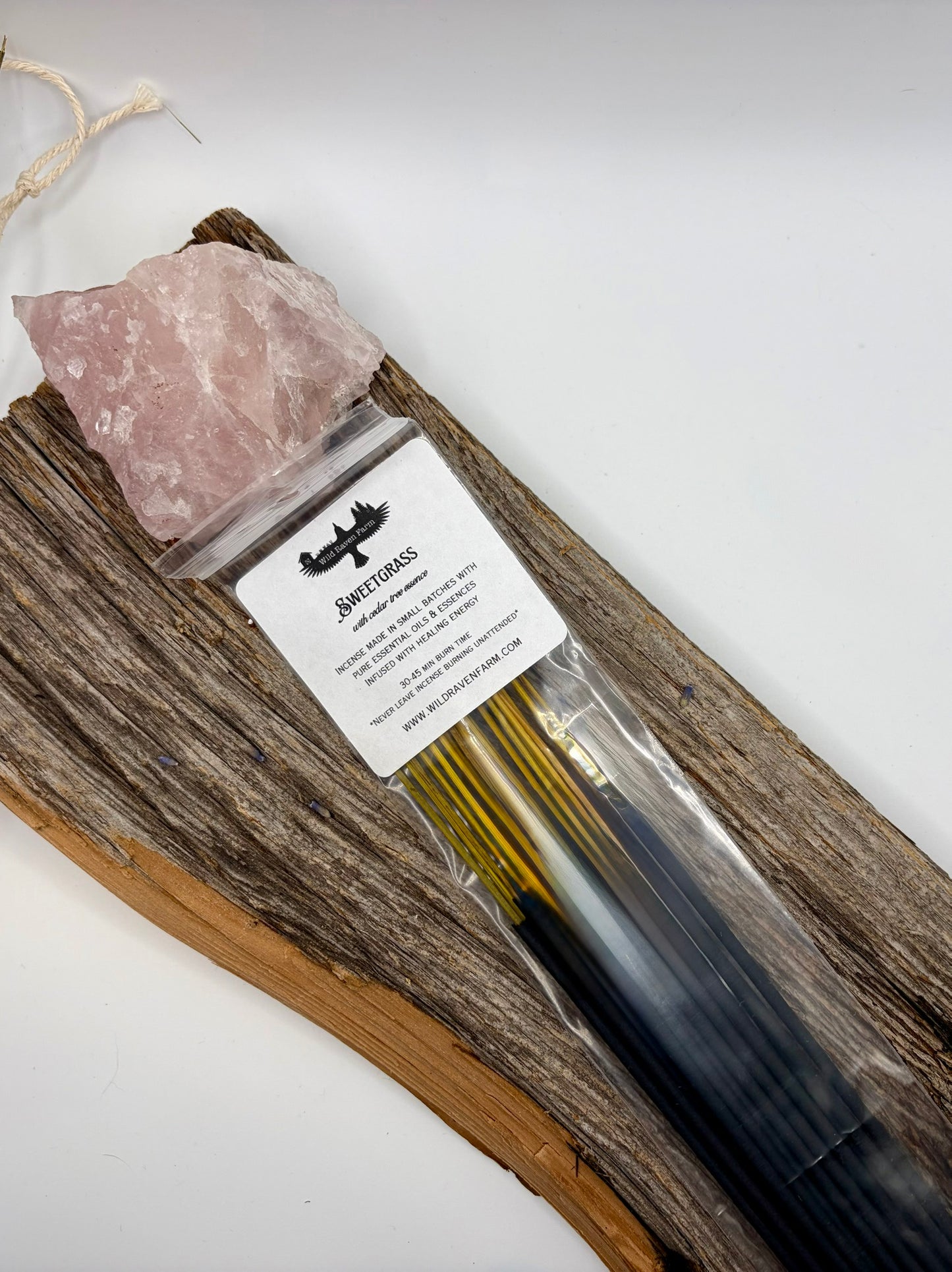 Set of incense sticks with a label on a wooden board